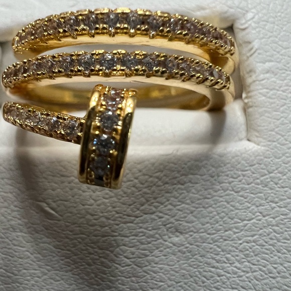Nail ring size small CZ all around and it’s very different color is Brass gold. - Picture 3 of 5